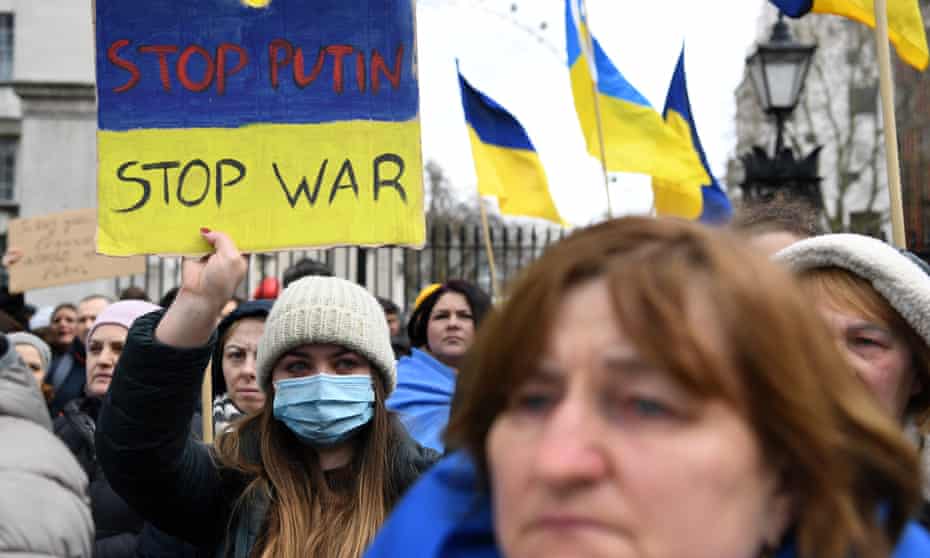Ukrainians protest against Russian invasion on Ukraine outside Downing Street in London, 24 February.