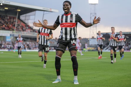 Justin Amaluzor celebrates after scoring Grimsby’s opening goal in the win at home to Shrewsbury that set up the tie against Manchester United.