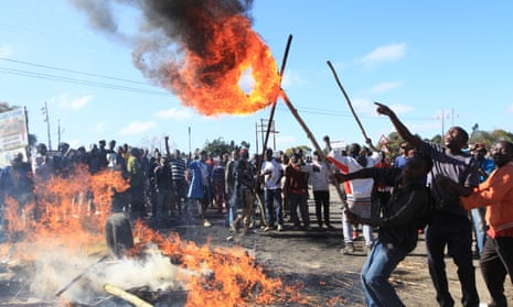 Rioters battle with Zimbabwean police in Harare.