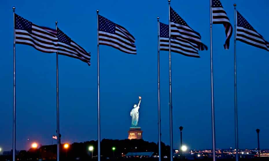 American flags and the Statue of Liberty in New York.