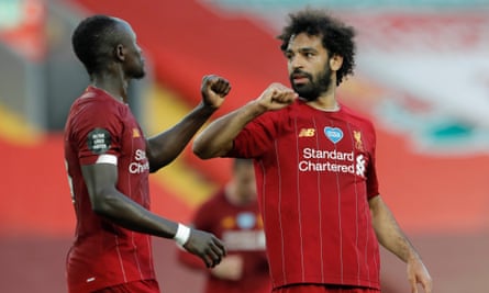 Mohamed Salah celebrates with Sadio Mané after scoring against Crystal Palace in June 2020.