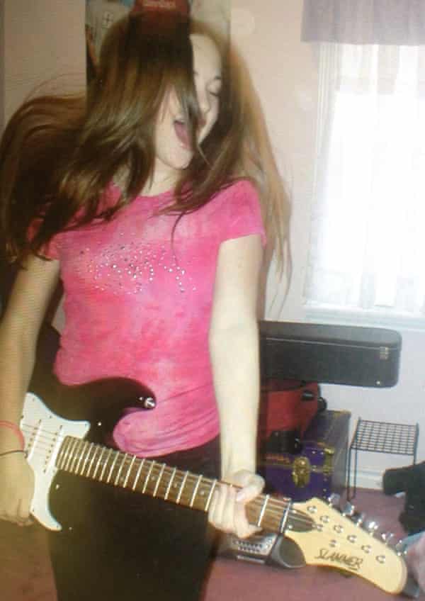 Country singer Kacey Musgraves with guitar, aged 12