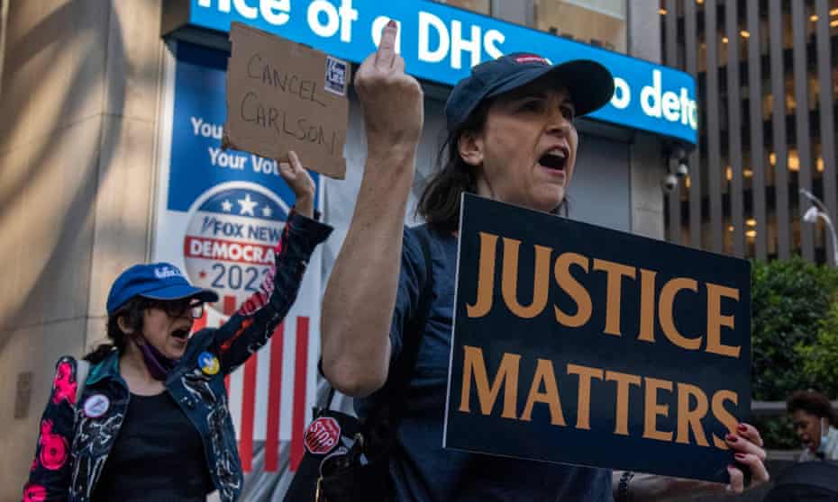 Protesters outside the Fox News headquarters in New York. Media and legal experts believe Fox could be in trouble in the Dominion case.