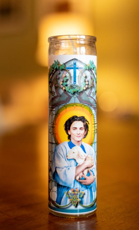 A Timothée-themed prayer candle portrays him dressed as a saint.