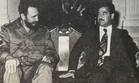 Fidel Castro poses with Saddam Hussein.