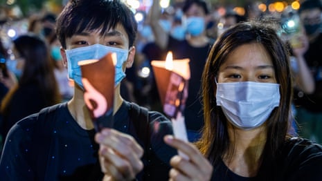 Thousands in Hong Kong defy ban to hold Tiananmen Square vigil – video