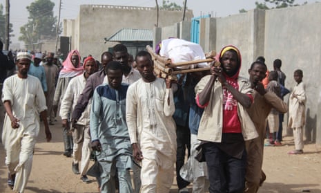 A burial procession on the outskirts of the Borno state capital, Maiduguri, after a Boko Haram attack. 