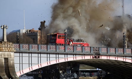 Smoke bellows from the double-decker bus shortly after the explosion on Sunday morning.