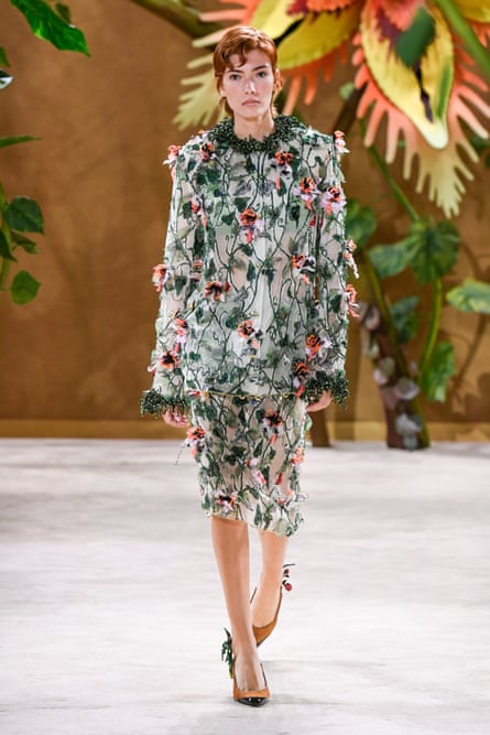 Model wearing sheer mousseline skirt suit embroidered with silk beanstalks