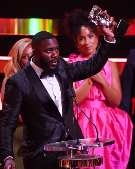 Collecting a Bafta for The Lateish Show.