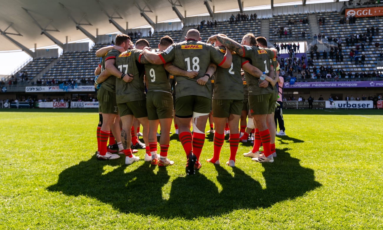 Harlequins players huddle after the first leg against Montpellier