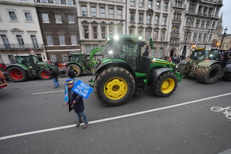 The anti-Brexit protester Steve Bray alongside the protesting farmers.