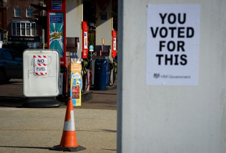 A political protest poster created by urban artist ‘Bod’ with the words, ‘You Voted For This, HM Government’ at a petrol station in Weymouth, United Kingdom today.