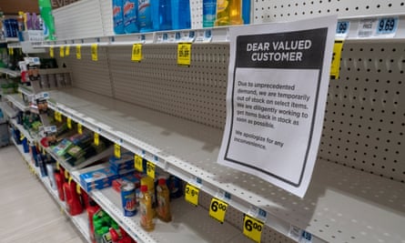 Shelves of household cleaners and disinfectant wipes are cleaned out at a Rite Aid store in Oakland, California. Grocery stores will stay open.