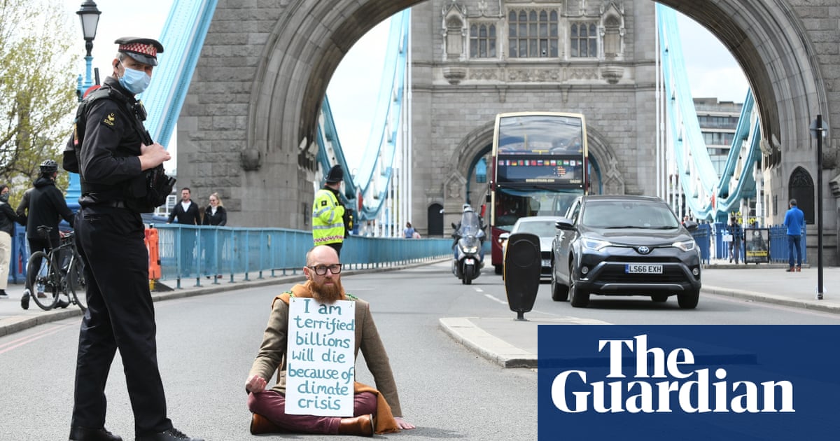 Climate activist arrested after gluing himself to Westminster Bridge