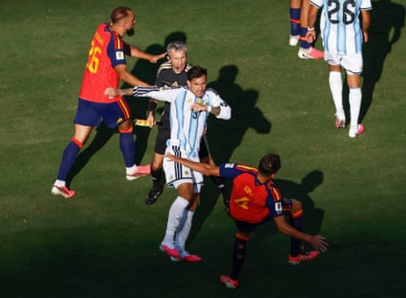 Argentina’s Leandro Paredes scuffles with Spain’s Eric Garcia