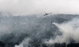 Helicoptering water on to Indonesia's forest fires