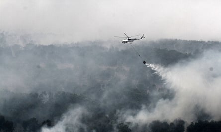 Helicoptering water on to Indonesia's forest fires