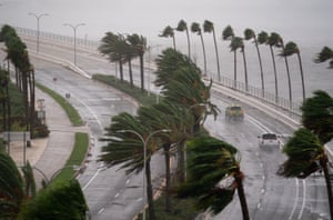 Motorists travel across the John Ringling Causeway as Hurricane Ian churns to the south , Sarasota