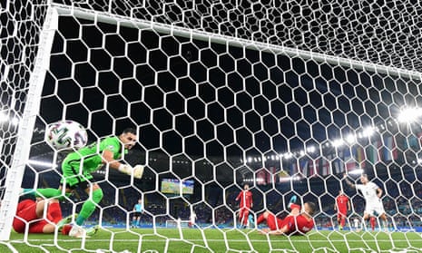 Turkey’s defender Merih Demiral scores an own goal.