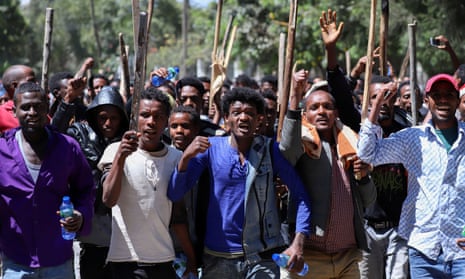 Oromo youth chant slogans during a protest in-front of activist Jawar Mohammed’s house in Addis Ababa.
