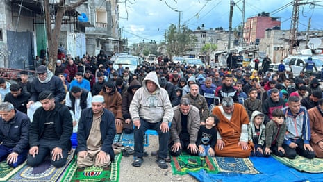 Muslims perform Eid al-Fitr prayer in the street next to the rubble of Rafah’s al-Farouk mosque.