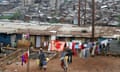 A family amid the corrugated iron shanty house slums of Nairobi