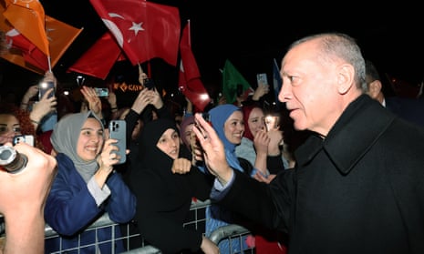 Turkish President Recep Tayyip Erdogan greets crowds on a surprise election night appearance in Istanbul