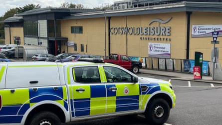Police vehicles parked outside Cirencester leisure centre