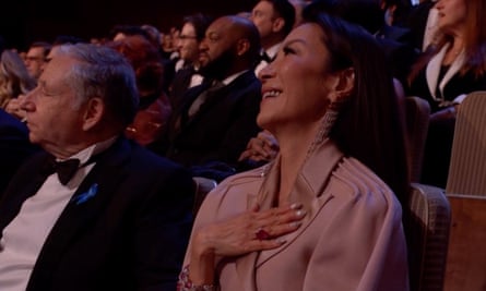 Michelle Yeoh reacts to her name being mentioned by DeBose.