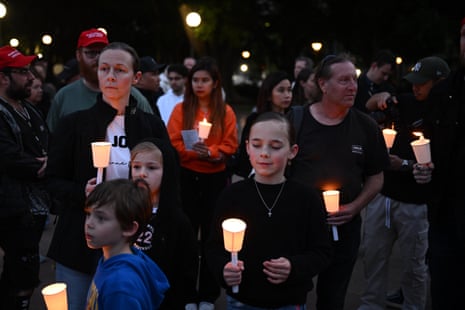 People attend a vigil for Charlie Kirk in Hyde Park, Sydney on Friday 12 September.