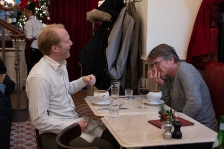 Rupert and Paul laughing at a restaurant table