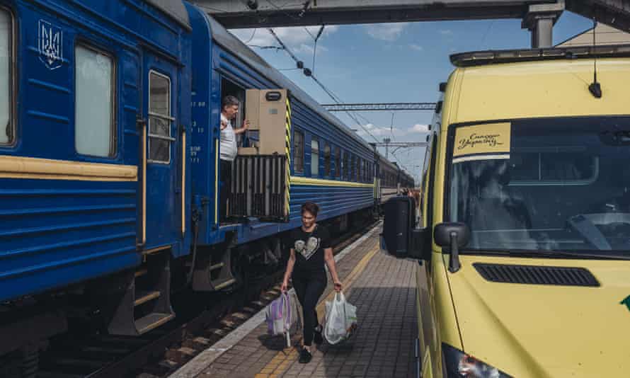 A woman displaced from Donbas walks to an evacuation train in Pokrovsk, Donetsk Oblast, Ukraine, on May 30, 2022.