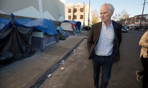 Philip Alston visits a homeless camp in Downtown LA. Alston said: ‘The persistence of extreme poverty is a political choice made by those in power. With political will, it could readily be eliminated.’