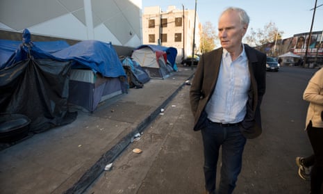 Philip Alston visits a homeless camp in Downtown LA. Alston said: ‘The persistence of extreme poverty is a political choice made by those in power. With political will, it could readily be eliminated.’