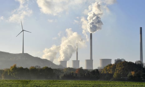 A coal-burning power plant near a wind turbine in Gelsenkirchen, Germany.