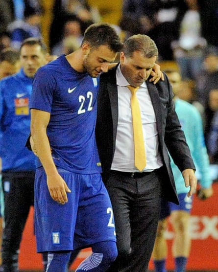 Andreas Samaris hugs Postecoglou after Greece played Australia in a friendly.