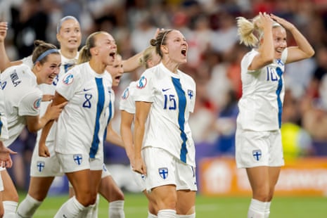 Natalia Kuikka of Finland celebrates with teammates after opening the scoring against Switzerland.