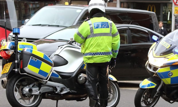 Met police officer with motorbike