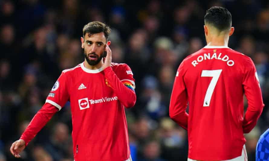 Bruno Fernandes speaks with compatriot Cristiano Ronaldo in the 1-1 draw against Chelsea.