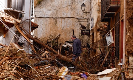 A man walks among the debris in Letur.