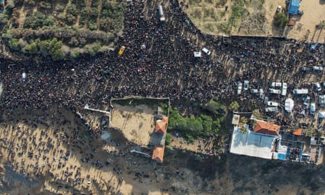 A drone view shows displaced Palestinians waiting to be allowed to return to their homes in northern Gaza.