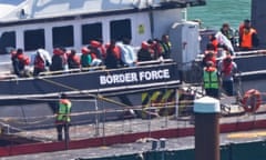 A group of people thought to be migrants are brought in to Dover, Kent, earlier this month.