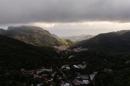 A view of forested hills around a city.