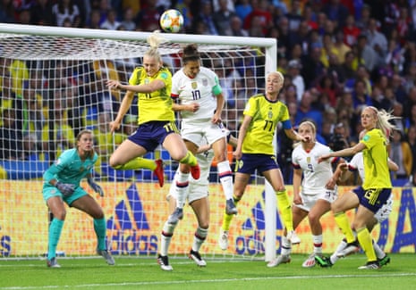Carli Lloyd of the USA competes for a header with Stina Blackstenius of Sweden.