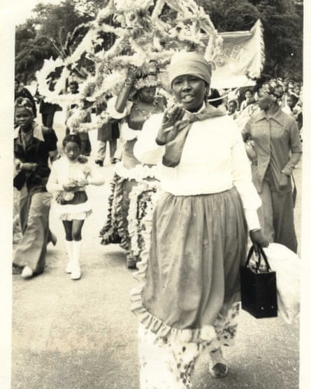 Black and white picture of woman leading carnival procession