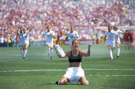 World Cup, USA Brandi Chastain victorious after scoring winning penalty kick as teammates celebrate in final vs CHN, Pasadena, CA 7/10/1999