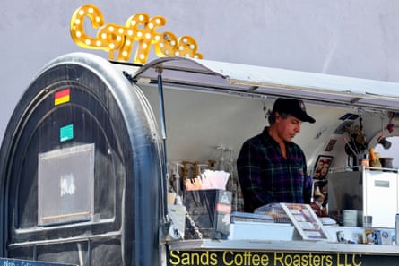 a man stands in a coffee shop