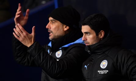 Mikel Arteta a week before he became Arsenal manager, with Pep Guardiola during Manchester City’s Carabao Cup quarter-final at Oxford