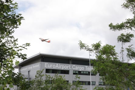 A plane taking off above the cargo terminal at the Basel Mulhouse Freiburg airport.